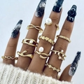 Detailed view of gold ring set with heart and pearl motifs worn on a model hand - 10-Piece Heart Infinity Pearl Style (26521-gold)