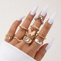 9-piece gold-tone boho ring set featuring butterfly, heart, and snake designs with zircons - Gold And Zirconia Decor Mixed Assortment (22733-gold)
