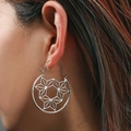 Bohemian vintage hollow geometric earrings in silver finish worn by a model - Silver Hollow Star Geometric (6758-silver)