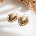 Bohemian gold hollow carved earrings with white beads on minimalist white surface - Gold Heart Hollow With White Beads (5886-gold)