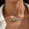 Collana a due strati in oro con perline malocchio blu e sfere dorate stile minimalista - Collana a doppio strato / Oro