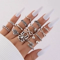 Detail view of vintage silver punk ring set featuring gothic skull and spider elements - 15-Piece Spider Star Moon Gothic Style (22724-silver)