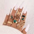 8-piece gold-tone ring set featuring green gemstones, snake, butterfly and heart motifs - Gold Emerald Green 8-Piece Set (22812-green)