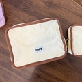 Portable beige canvas makeup bag with brown trim and HOPE label for travel storage - Large / Off White