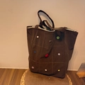Brown corduroy shoulder bag featuring colorful buttons and a zipper closure - Brown