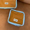 Brown and blue nylon travel cosmetic bag with HOPE tag in flat lay view - Small / Brown