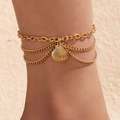 Three-layer gold ankle chain with bohemian shell pendant on textured background - Gold Scallop Style (20014扇贝)