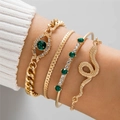 Gold emerald heart and snake bracelet set with diamond accents on a model's wrist - Gold 4Pcs Set Green Stone Evil Eye Snake Charm (25769-gold)