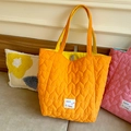 Quilted tote bag in bright orange heart pattern with a pink contrast variant - Bright Orange Heart Quilted Reversible Tote Bag