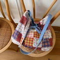 Macro view of reversible patchwork denim tote bag with floral patterns and denim ribbon - Pink Pastoral Style (Random Pattern Cycle)