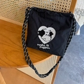 Bolso bandolera de nailon negro con bordado de perro corazón y correa trenzada - Cachorro de Corazón Negro