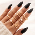 8pcs gold ring set featuring heart cutouts and pearls on a model hand with black nails - Gold (21592-gold)