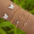 Ensemble de quatre bracelets dorés avec motifs papillon et détails en faux bijoux - Ensemble Quatre Pièces Blanc (23020-white)
