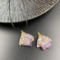 Irregular amethyst wire wrapped pendant with gold wire and pearl accent on black background - Amethyst Style