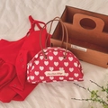 Vintage semicircular red canvas handbag with white heart pattern and leather handles - White Heart Patch Bag