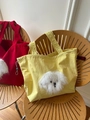 Detailansicht der Canvas-Tasche mit Plüschtier-Dekor und grauem Kordelzugverschluss - Doppellagiger Gelber Plüschhund