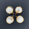 Set of four circular white turquoise pendants with golden wire wrap spiral design - Howlite