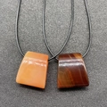 Natural agate trapezoid pendants in honey and dark brown with woven black cords - 1 Piece / Red Agate