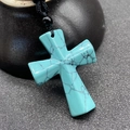 Ethnic style turquoise cross necklace with natural black veins on a woven cord - Synthetic Blue Turquoise