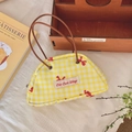Bolso de mano semicircular de cuadros amarillos con asas marrones y detalle de lazo rojo - Bolso de Parche Cuadros Amarillo Blanco