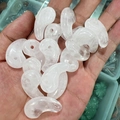 Translucent pink natural crystal stone Magatama comma-shaped pendants in hand - White Crystal