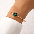 Minimalist open gold bangle with heart-shaped green gemstone and beaded metal edge - Heart Green Gem Style (25077-gold)