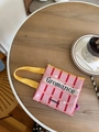 Roze geruite canvas clutch tas met geel handvat en bedrukt tekstlogo - Roze Raster Gromance Stijl / Roze