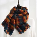 Thick plaid shawl scarf in blue, orange, and red with short fringe details - Circle Plaid Orange