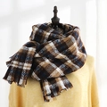 Classic plaid scarf in brown and blue with soft tassels shown on a dress form - Circle Plaid Blue