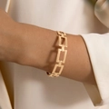 Elegant gold open bracelet with floral petal design and glossy pearl embellishment - Rectangular Hollow Geometric Chain Style (24475-gold)