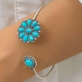 Silver open bangle featuring a floral petal motif and turquoise stone in boho style - Turquoise Petal Oval Gem Style (25456-blue)