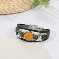 Retro multi-layer woven leather bracelet with amber bead and silver bell charms - Topaz