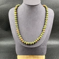 Natural green and reddish-brown stone beaded necklace with flat-round mineral beads - Unakite