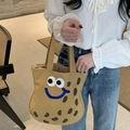 Close-up of khaki canvas tote bag featuring cute cartoon face embroidery and smile detail - Khaki Peanut Small Handheld