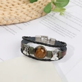 Vintage multilayer leather bracelet with tiger eye stone and silver bell accents - Tiger's Eye