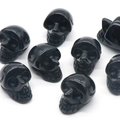 Polished black obsidian skull carvings for Halloween gothic home decor and healing - Obsidian