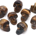 Tiger Eye stone skull carvings with natural yellow and brown silk luster texture - Tiger's Eye