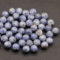 Polished 12mm sodalite gemstone round beads with mottled blue and white texture - Sodalite