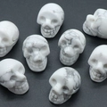 Polished white howlite crystal skulls with natural grey marble patterns for Halloween - Howlite