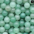 Stack of 8mm natural green aventurine round beads with smooth texture and mint green tones - Green Aventurine