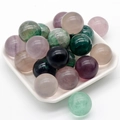 Polished 20mm natural amethyst and mixed quartz gemstone spheres in a white ceramic dish - Fluorite