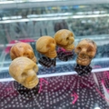 Handcrafted natural agate crystal skull carvings in amber tones for Halloween decor - Crazy Agate