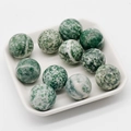 Polished 20mm natural green moss agate stone spheres in a white ceramic tray - Blue Spot Jasper