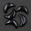 Polished black obsidian moon shaped stones with smooth reflective finish - Obsidian