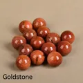 Polished 20mm brown goldstone round bead with shimmering metallic particles - Goldstone (Synthetic)