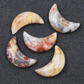 Set of five polished natural moon-shaped agate and crystal stones with mineral textures - Crazy Agate