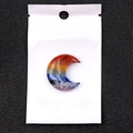 Detail view of crescent moon shaped chakra stone with vibrant seven color stripes - Moon