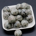 Polished 20mm Dalmatian Jasper stone spheres presented in a square white tray - Tianshan Blue