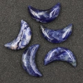Five pieces of blue sodalite moon shaped stones with natural white marble textures - Blue Spot Stone