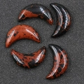 Moon shaped mahogany obsidian stones with natural reddish-brown and black marbled textures - Mahogany Obsidian